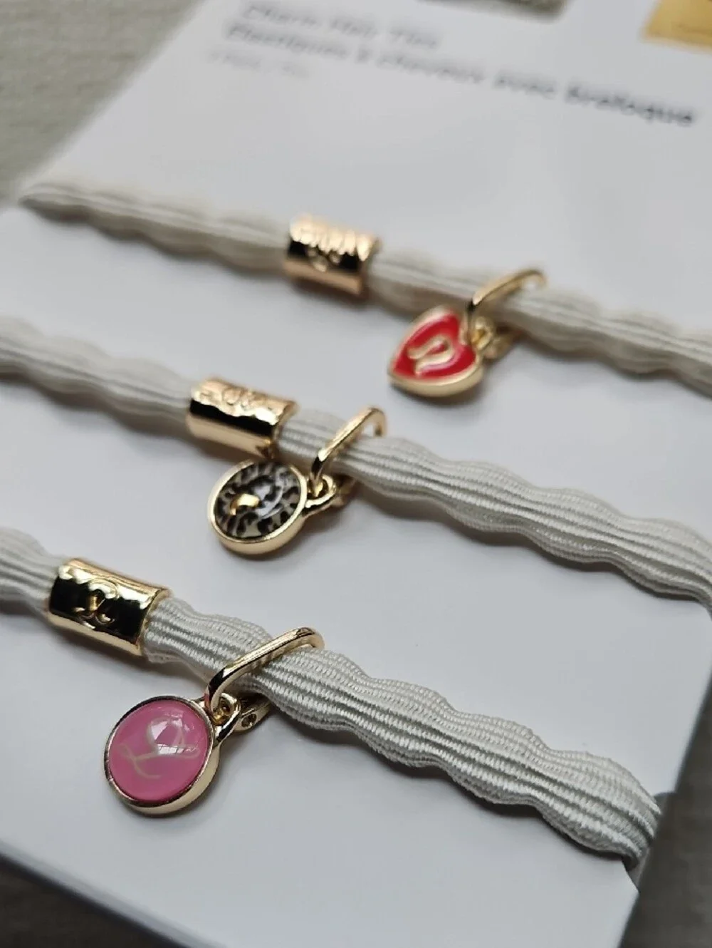 lululemon athletica Charm Hair Ties Trio — White Bands with Red & Pink Charms